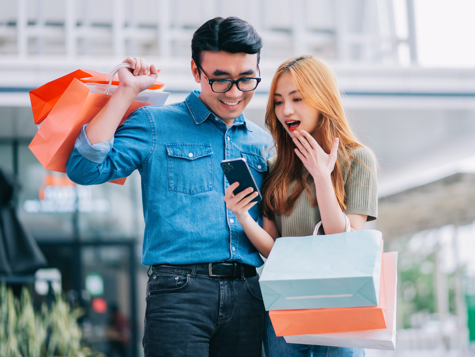 Asian couple shopping at the mall
