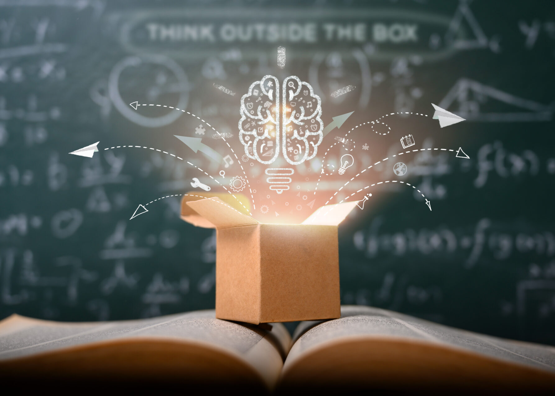 think outside the box on school green blackboard . startup educ